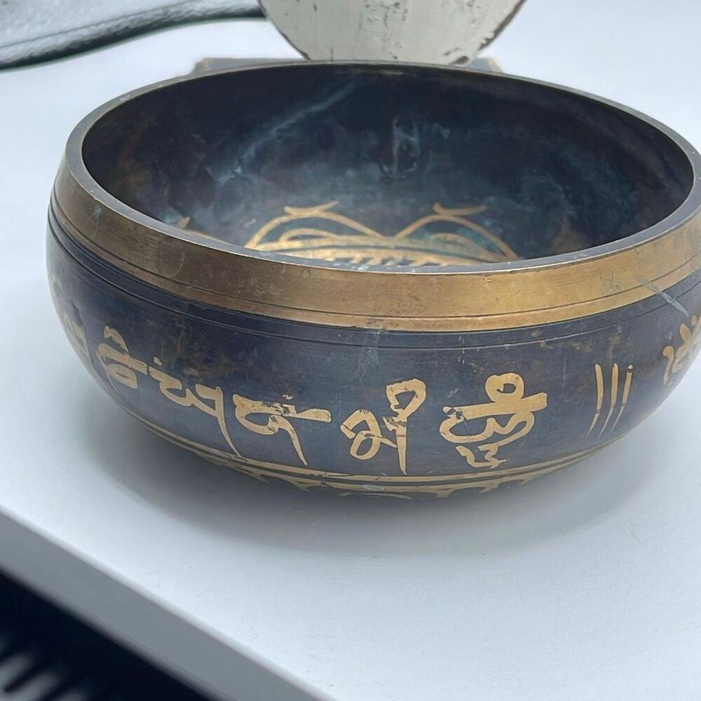 Vintage decretive brass Tibetan sing bowl brass mantra & mandala carvings.